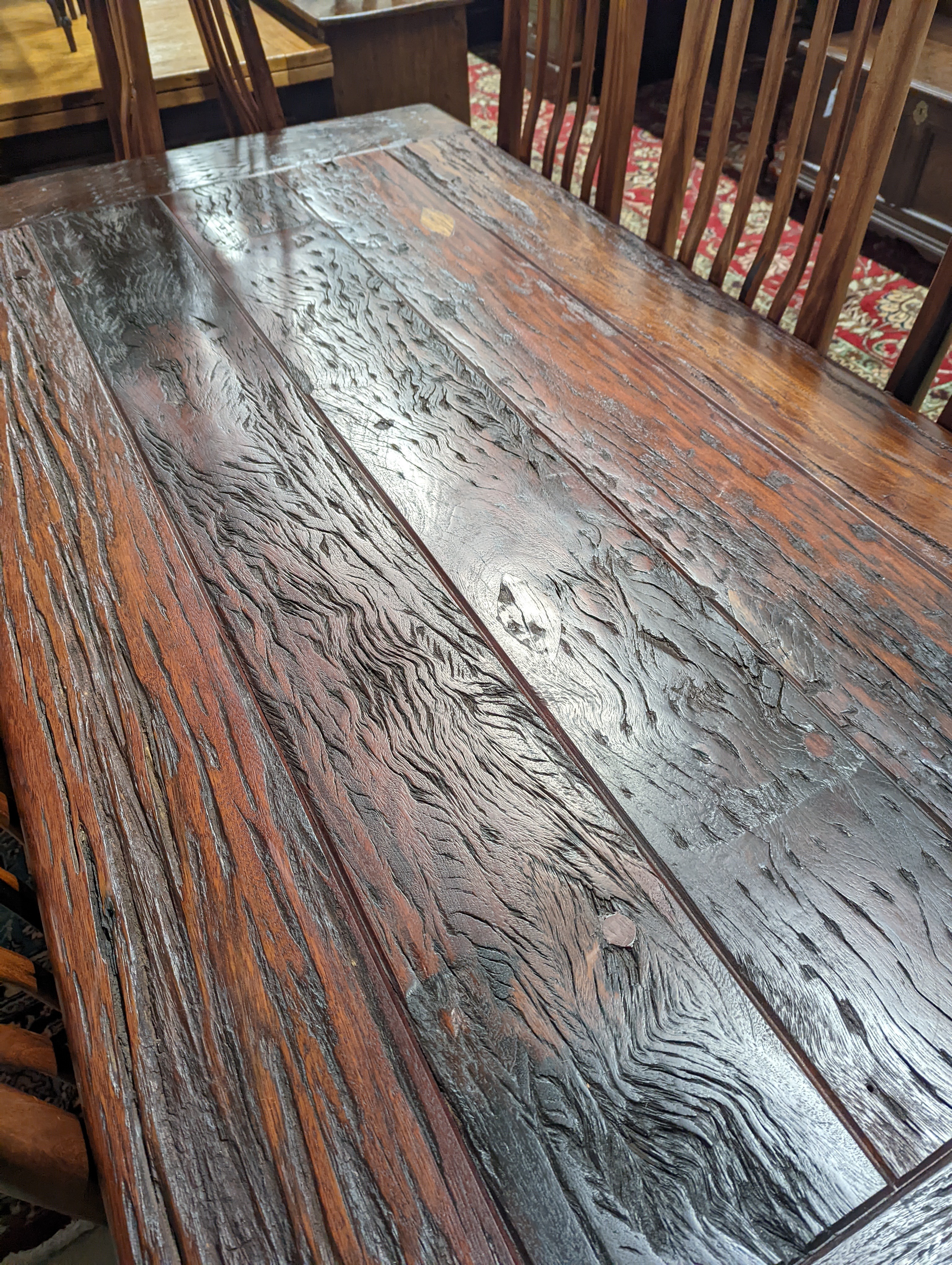 A South African distressed hardwood rectangular refectory dining table, length 200cm, depth 100cm, height 75cm and eight hardwood high back wood seat dining chairs